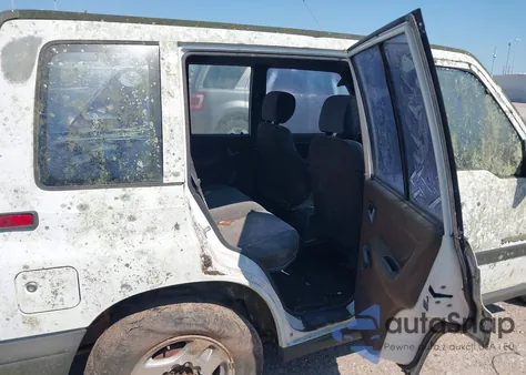 1996 Geo Tracker from USA, damaged, VIN 2CNBE1369T6943219